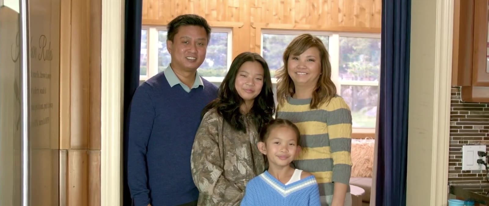 A family at home, mid-laugh